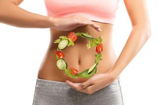 A graphic depicting salad vegetables in a circle in front of a person's stomach
