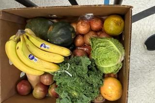 A box of donated fruits and vegetables
