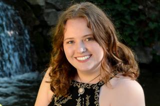 Annabelle Hannah ’25 seated by a waterfall