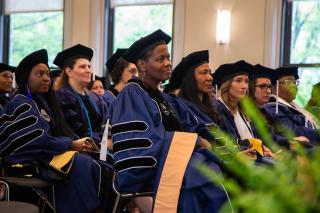 Doctoral candidates in attendance at the Doctoral Hooding Ceremony
