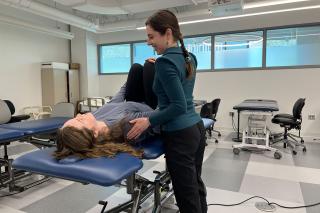 Amanda Michel ’23, ’25DPT in action in the PT lab at Simmons