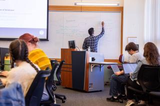 Professor Naresh Agarwal teaches a course at SLIS, photograph by Ashley Purvis.