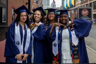 4 Simmons students lined up for Commencement