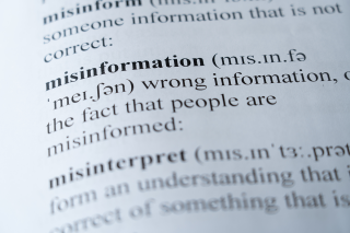 A close-up photo of a dictionary entry of the definition of misinformation