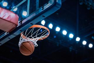 A basketball swishing through the net