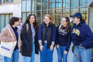 Students outside of Drinan Hall