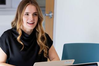 Management Student sitting at computer