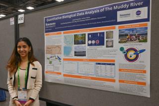 Janhavi Beley ’27 with her poster from the Society for Advancement of Chicanos/Hispanics & Native Americans in Science (SACNAS) National Diversity in STEM conference