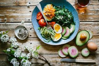 A plate of vegetables on a wooden table