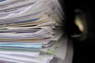 A stack of files. Photo credit: Niklas Bildhauer on Wikimedia Commons