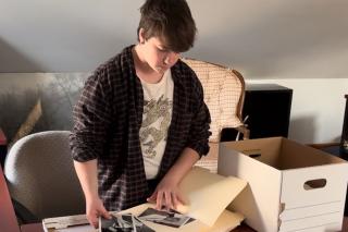 Ashten Vassar-Cain ’27MS working with some archival images