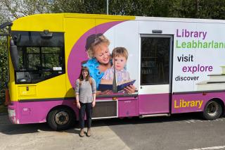 Danielle Dempsey ’24MS in front of a mobile library