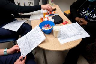 Nursing students simulating working with a patient to discuss their medication