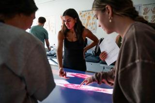 Valeria Caballero and other PT students using an anatomage table
