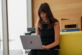 Student sitting with laptop