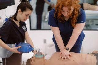 Nursing students in simulation lab practicing CPR