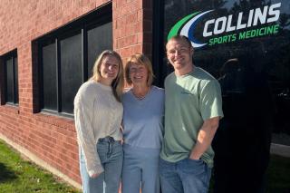 Carole Collins ’83 with her children, Kelsey and Jake, outside Collins Sports Medicine