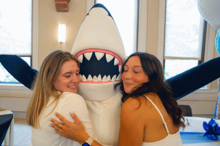 Stormy, the Simmons University mascot, welcomes new students.