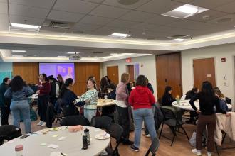 A group of Simmons students participating in a workshop activity