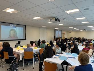 A room full of Simmons students listening to Jean Chin discuss her career