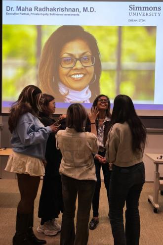 Students standing in a circle with Dr. Maha Radhakrishnan