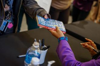 Book signing at the Fall 2025 community read