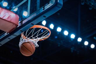 A basketball swishing through the net