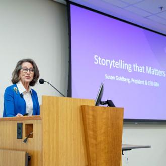 Susan Goldberg at the podium delivering the keynote address at the 2026 Ifill Forum