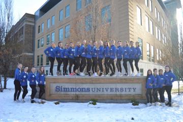 Simmons Gymnastics on Simmons University sign