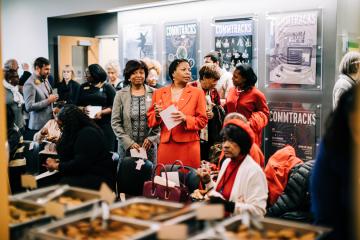 Attendees gather before the Ifill Stamp event.