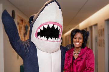 President Lynn Perry Wooten and Stormy the Shark