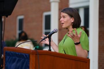 Interim Vice President of Advancement Cate McLaughlin speaking at the Candle Lighting ceremony