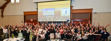 A large group of students and alums at the ECONnect event in 2025