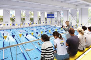 A rendering of students both in the pool and on the bleachers in the pool area of the new Living and Learning Center