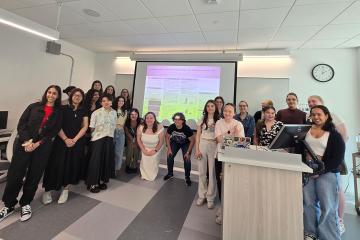 A group of Simmons students in a classroom during a summer research experience