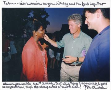 1995 photograph of Gwen Ifill ’77, ’93HD and (then) President Bill Clinton, inscribed by Clinton, from the Gwen Ifill Papers collection, courtesy of Simmons University Archives.