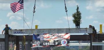 The final beam being placed atop the Living Learning Center