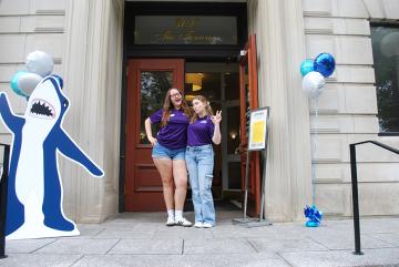 Orientation 2025 - Orientation Leaders greeting you at the main MCB entrance. A cutout of Stormy also says hi.
