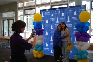 Orientation 2025 - Students posing together for a picture at the Selfie Station