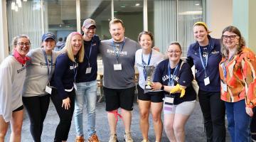 Alumns posing for photo at event