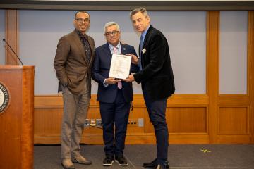 Associate Professor of Practice Samuel Odom, Commissioner of Veterans Services Robert Santiago, and SSW Dean Michael LaSala.