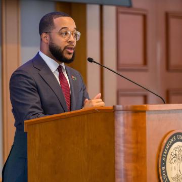 City of Boston Chief of Economic Opportunity and Inclusion Segun Idowu speaking at the 2026 MLK breakfast