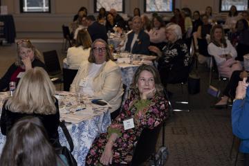 A room full of attendees at the Woman's College Coalition event in 2026