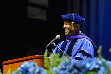 Dr. Anthony Estreet, Chief Executive Officer of the National Association of Social Workers (NASW) speaking at the 2026 Simmons University Commencement ceremony.