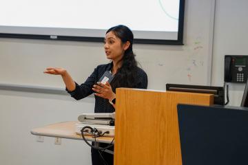 A student engaging with the audience at a presentation during the 2026 STEM Colloquium