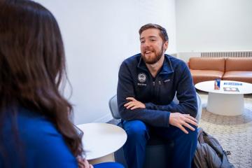 Two nursing students having a conversation.