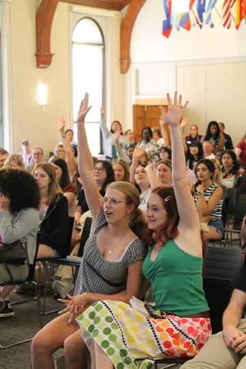 Orientation 2026 - Students in LPK raising hands