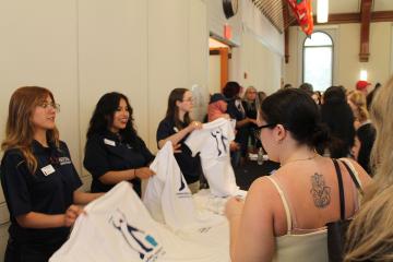 Orientation 2026 - Students receiving their t-shirts
