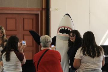 Orientation 2026 - Students posing with Stormy