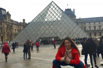 Kaitlyn Lapeyre in front of the Louvre.